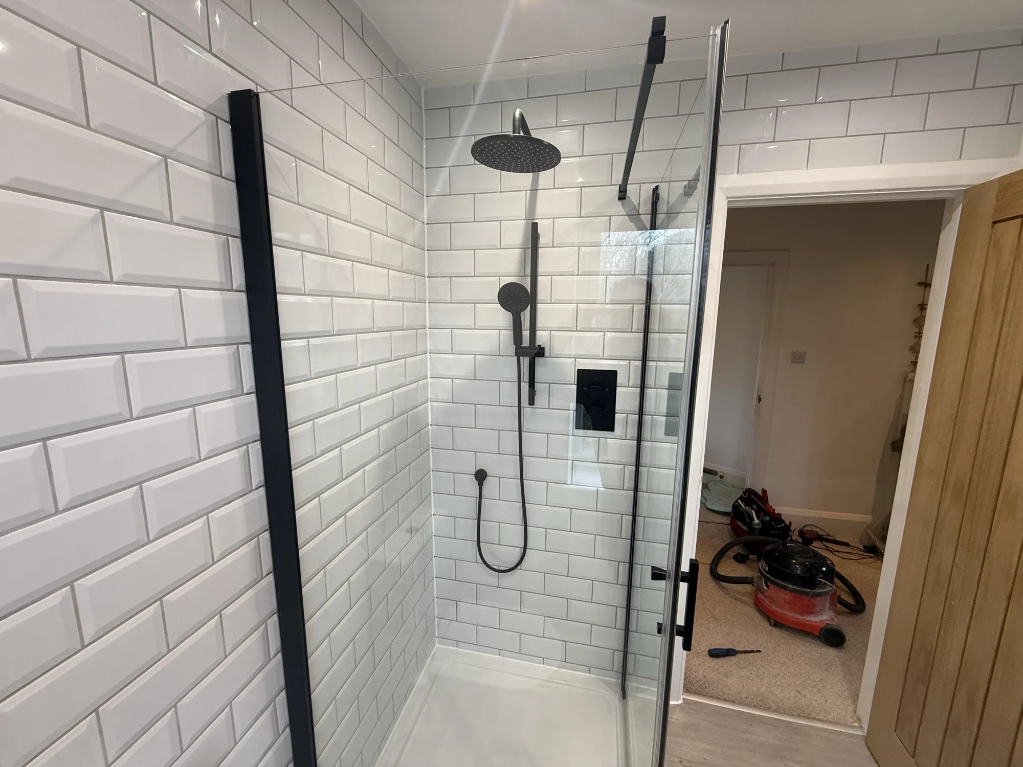 Walk-in shower installation in a Bude bathroom