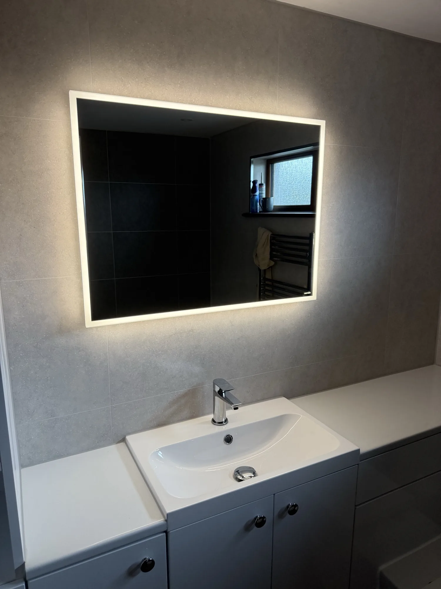 Tiled bathroom wall detail by AH Plumbing and Heating